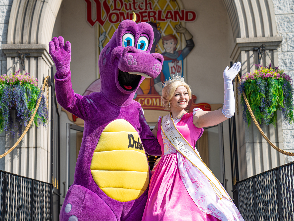 Duke and Princess Brooke waving at front of castle