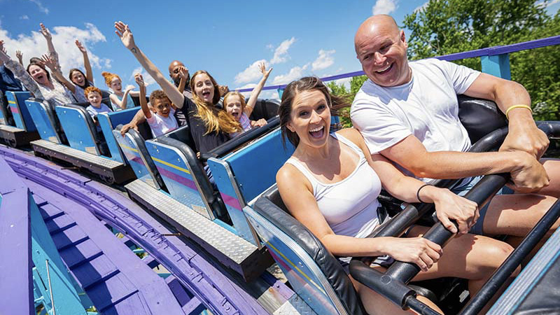 Riders Having Fun and  Laughing On Coaster