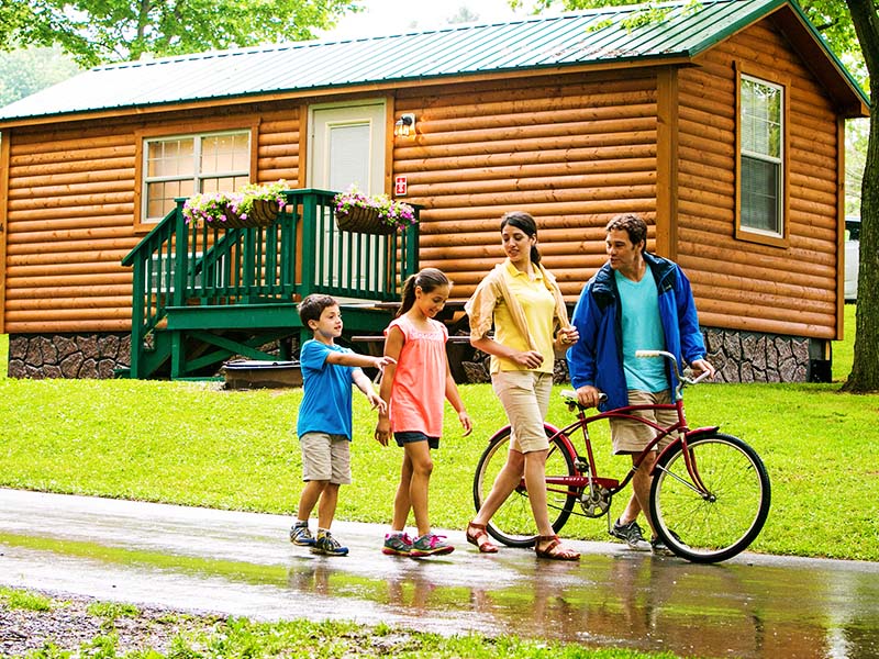 Family in front of cabin