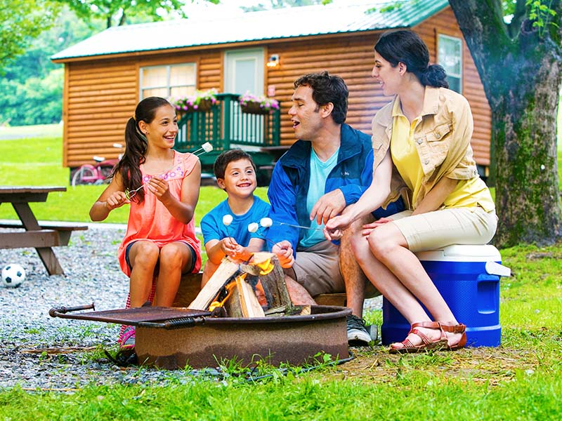 Family in front of campfire