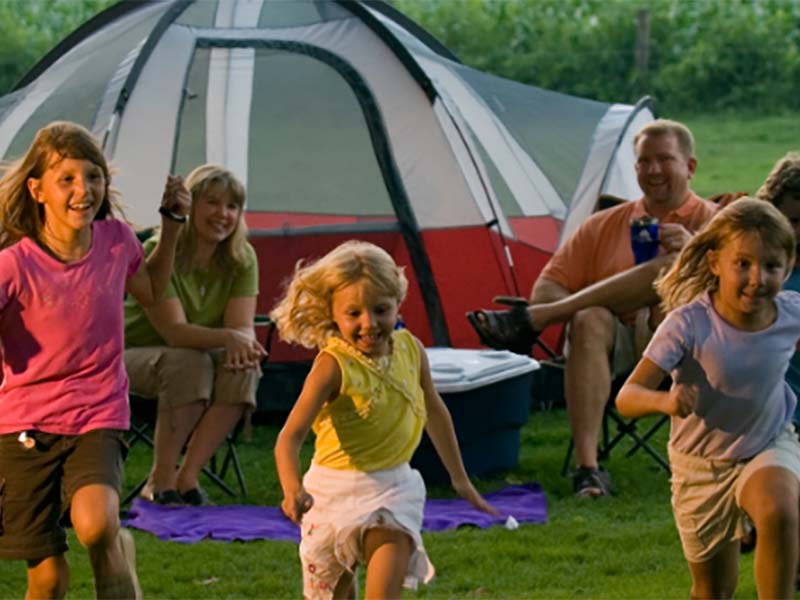 Family running near tent